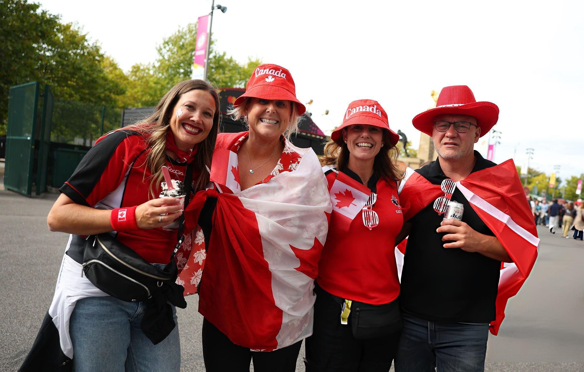 Canadian fans dressed in red celebrating in Vancouver 