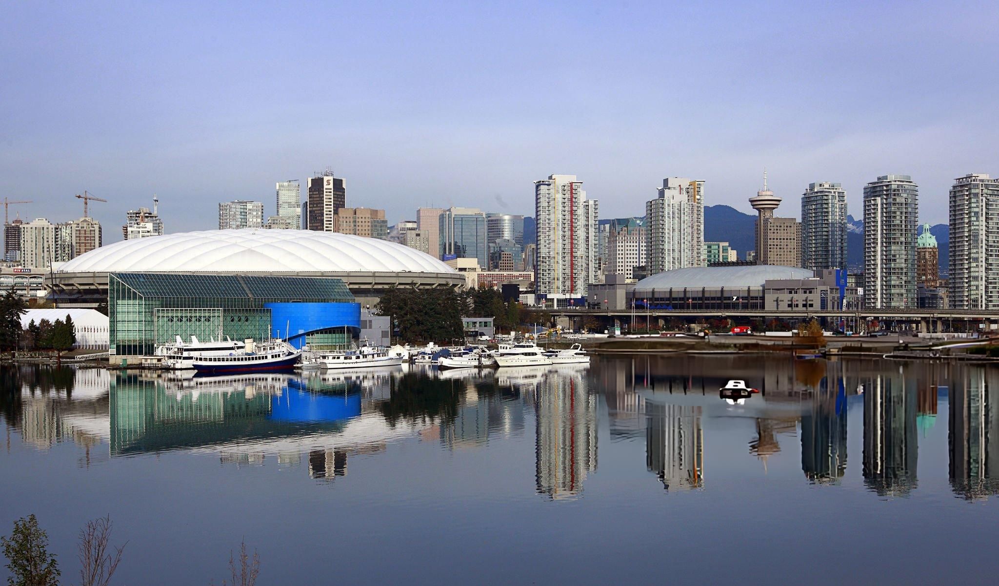 BC Place stadium and Vancouver skyline reflected on False Creek during FIFA World Cup 2026 host city preparations.