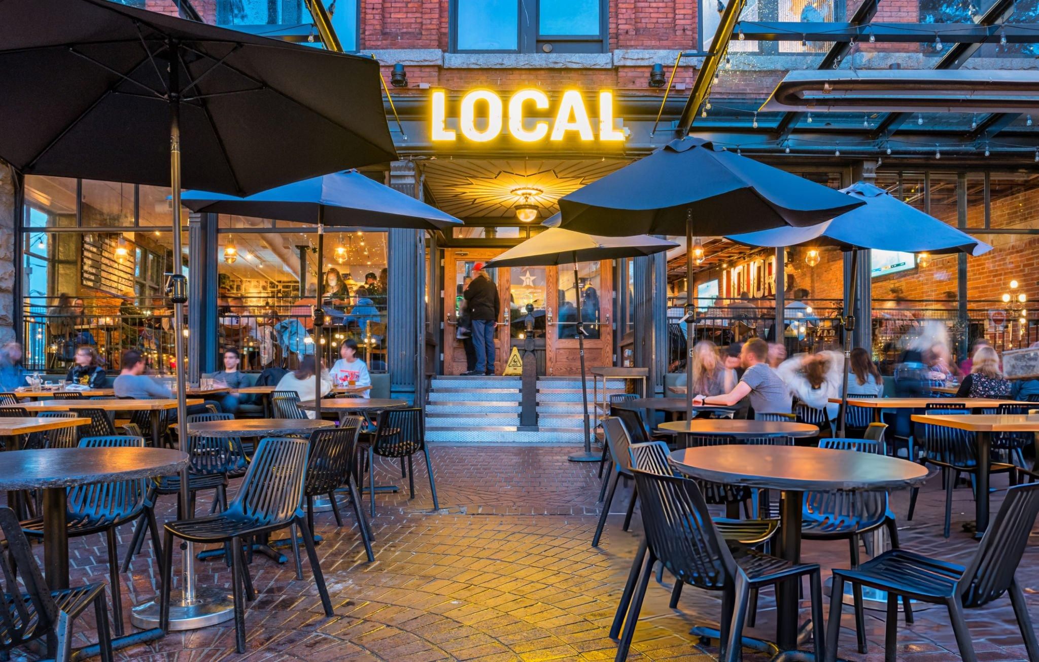 Outdoor sports bar patio in downtown Vancouver where fans gather to watch football.