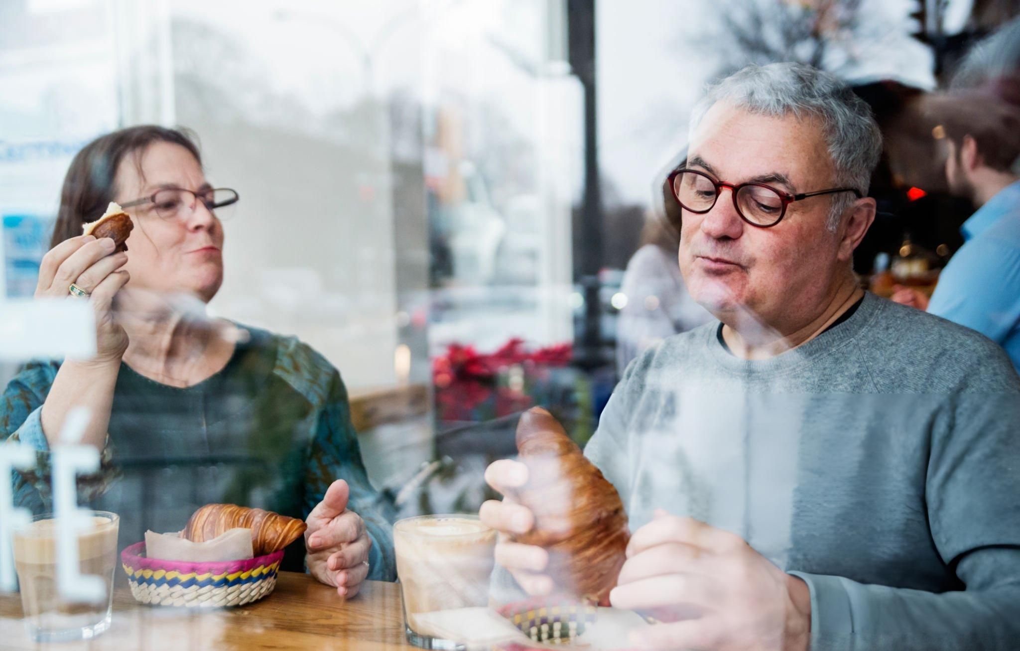 Couple eating in a small local bakery shop in Vancouver